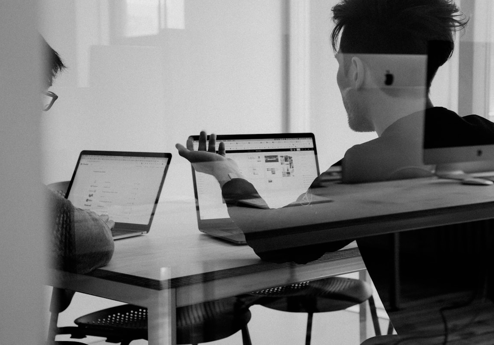 QSYS team discussing business workflows